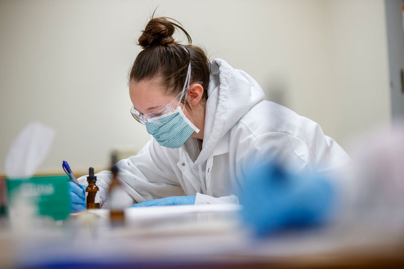UNL student in a forensics lab