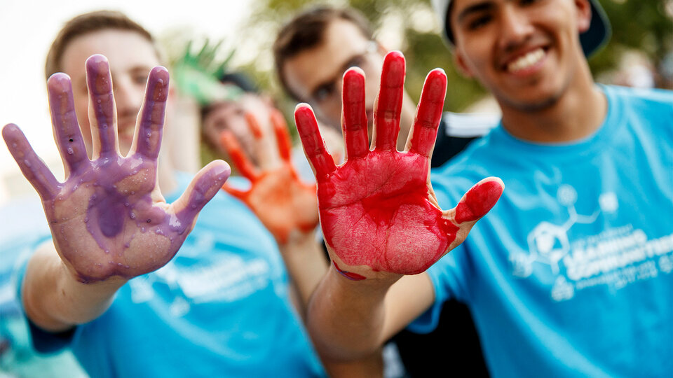 LC students with painted hands at the Welcome Event