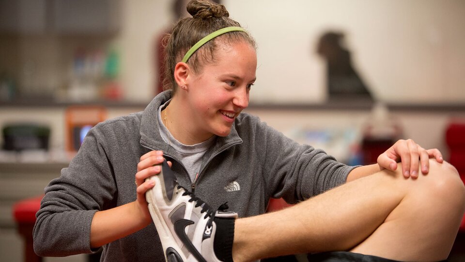 Student practicing physical therapy