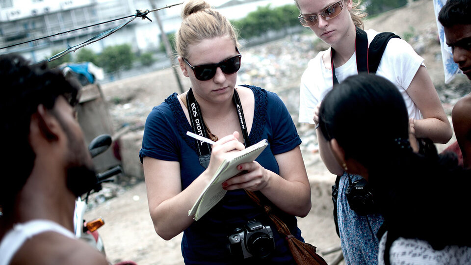 Student reporters interviewing individuals