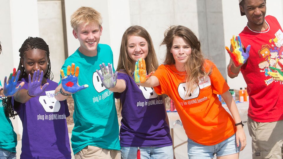 Students showing their painted hands at the LC Welcome Event