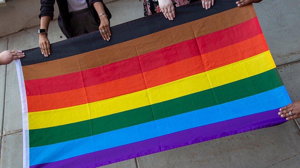 LGBTQA+ Pride flag being displayed